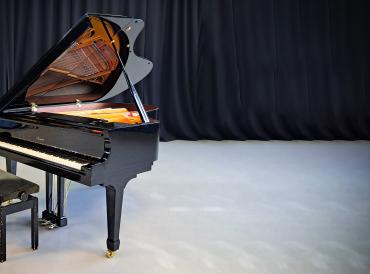 Photo of baby grand piano at LAMDA in the John Wood studio